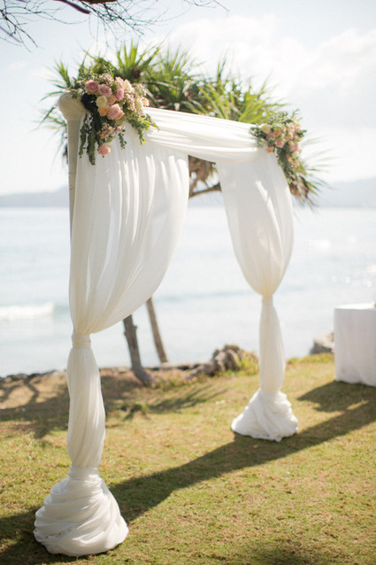White draped floral altar