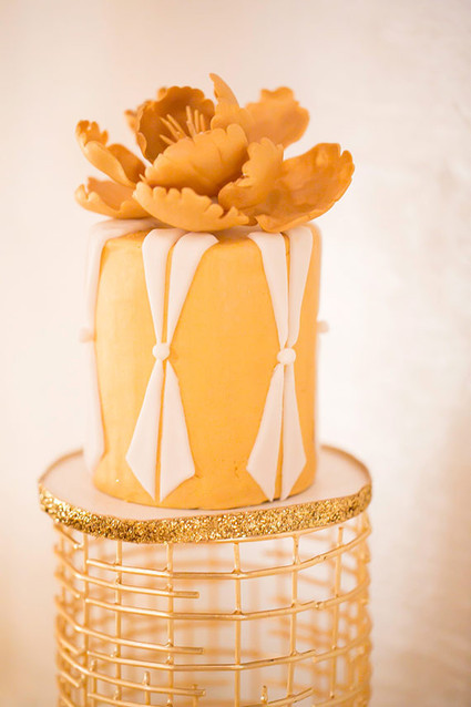 Gold cake with floral topper