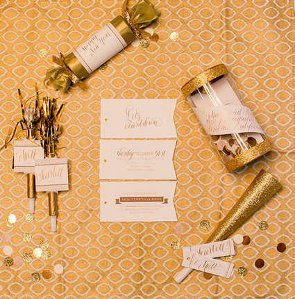 New Years gold confetti poppers and blow horns