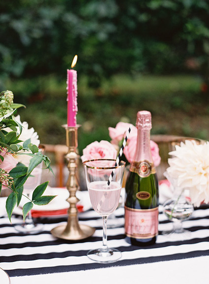 Gold candlestick with pink candle