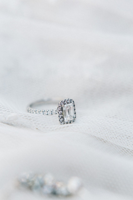 Emerald cut diamond with halo and platinum band