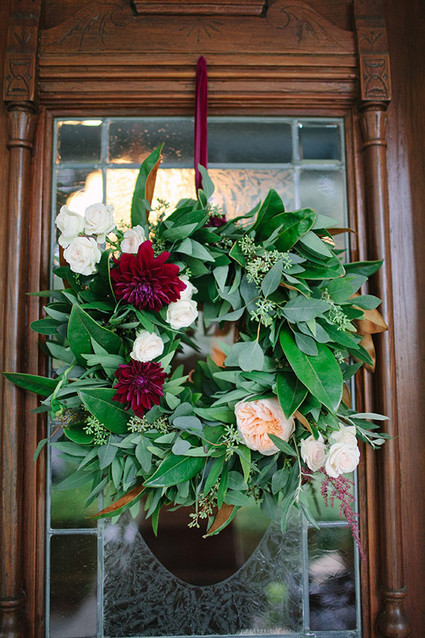 Greenery and deep red hanging flowers