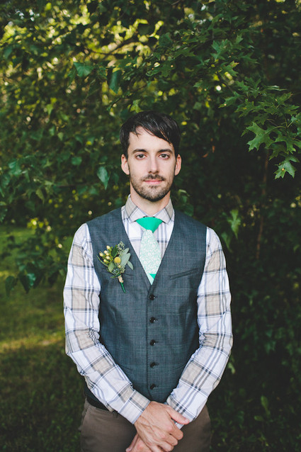 Groom with grey vest and striped shirt
