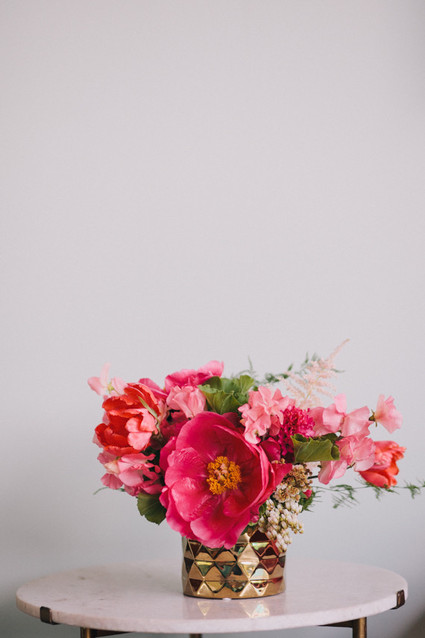 Pink anemones with gold vase