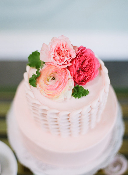 Light pink cake with flower cake topper