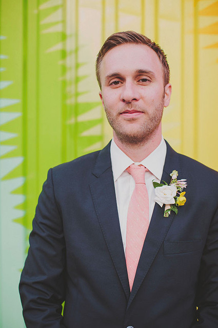 Groom with pink tie and boutonniere