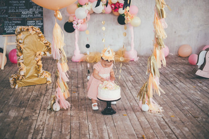 first birthday party with fringe and balloons