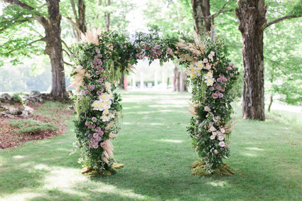 Lush floral ceremony arbor