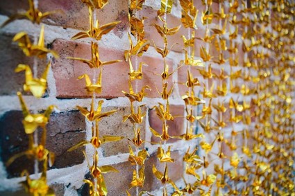 Gold paper crane ceremony backdrop,