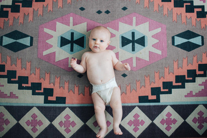 boho rug and baby portrait