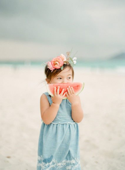 little girls on the beach with flower crowns and watermelon