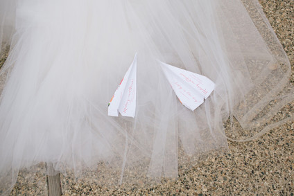 Paper airplane wedding programs