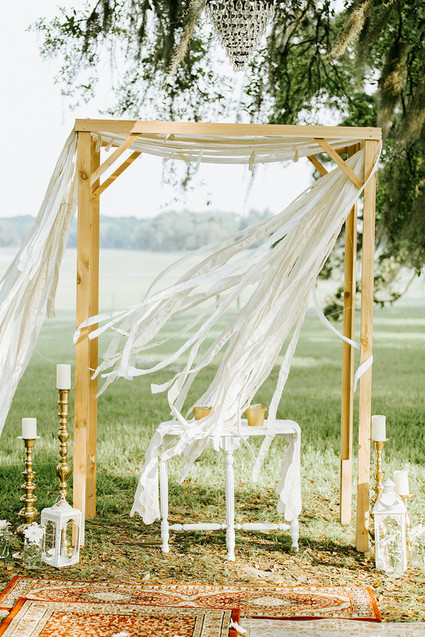 Rustic bohemian ceremony arbor