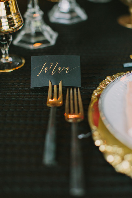 black and gold place setting