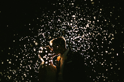 nighttime confetti wedding portrait