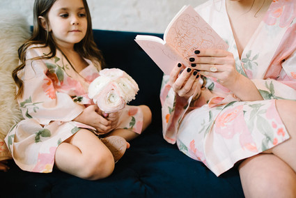 bride and flower girl getting ready