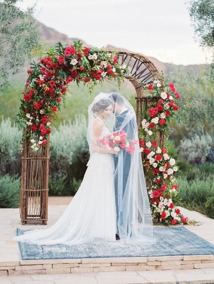Red floral wedding arbor