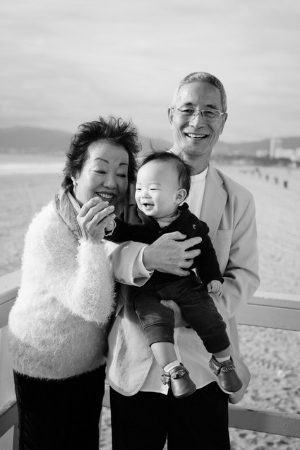 multi generation family photos at the beach