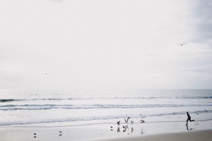 multi generation family photos at the beach