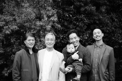 multi generation family photos at the beach