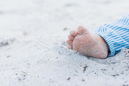 Summery matching sibling photos on the beach