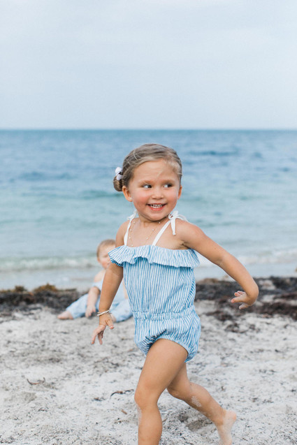 Summery matching sibling photos on the beach
