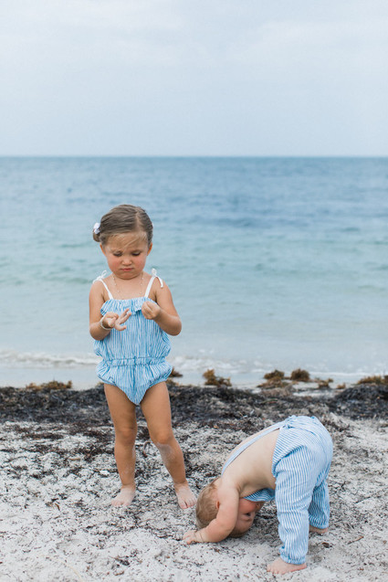 Summery matching sibling photos on the beach
