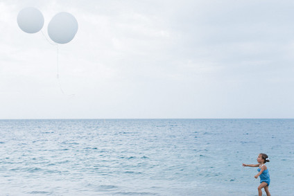 Summery matching sibling photos on the beach
