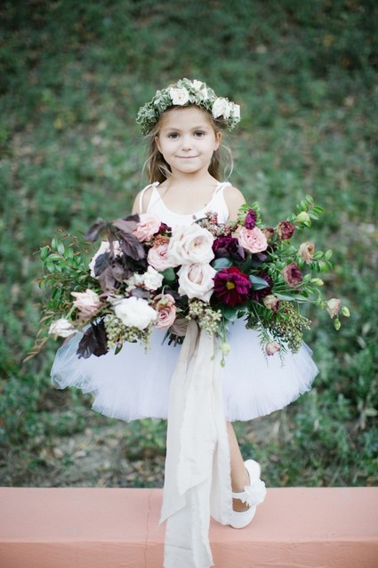 Flower girl with flower crown and bouquet