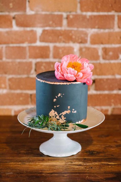 black wedding cake with coral peony