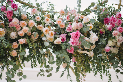 pink floral ceremony arch