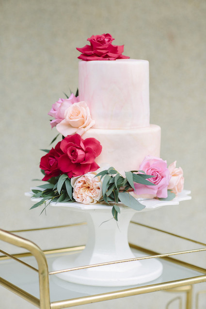 pink wedding cake with peonies