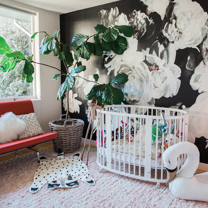 modern girl's nursery with floral wallpaper