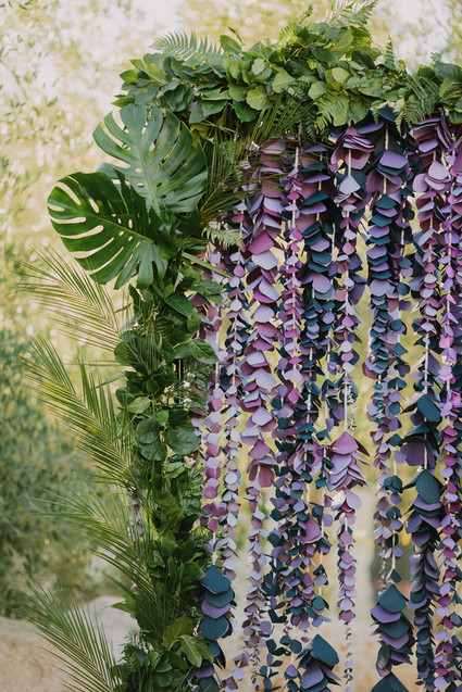 Purple paper flower wedding ceremony back drop