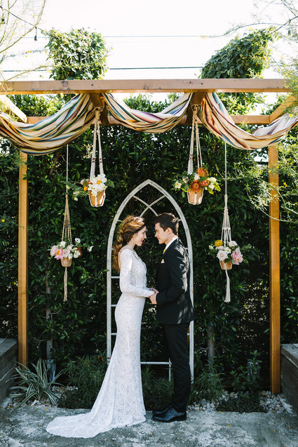 eclectic ceremony decor with macrame plant holders Inspiration