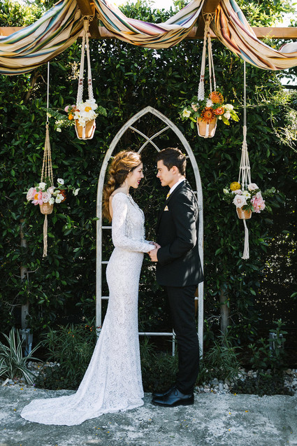 eclectic ceremony decor with macrame plant holders Inspiration