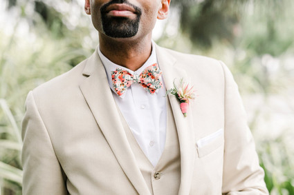 Groom with khaki suit and floral bowtie