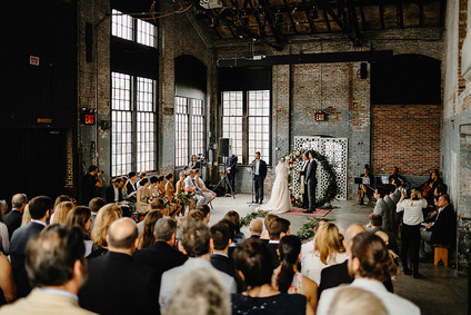 Romantic, industrial, floral wedding at Basilica Hudson in the Hudson Valley