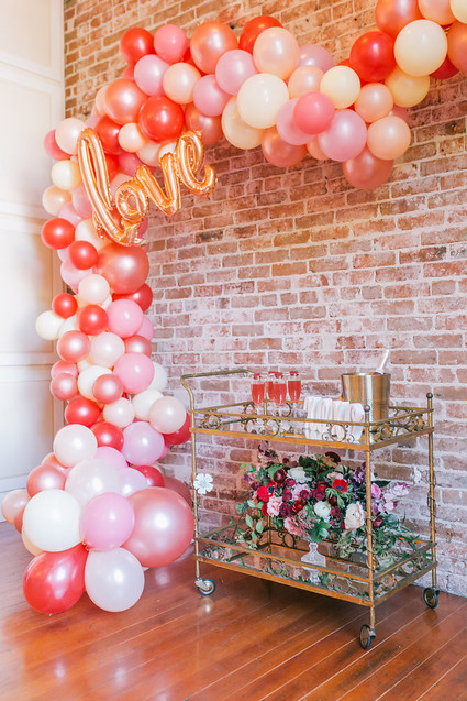 balloon arch and bar cart