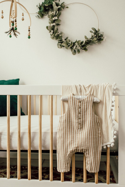 Gender neutral gold and emerald boho nursery