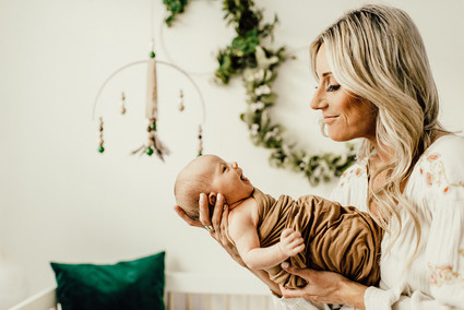Gender neutral gold and emerald boho nursery