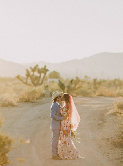 Rustic Joshua Tree wedding with a pink floral dress