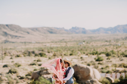 Rustic Joshua Tree wedding with a pink floral dress