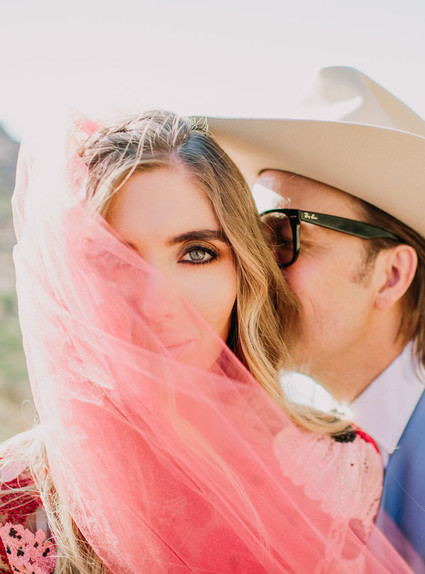 Rustic Joshua Tree wedding with a pink floral dress