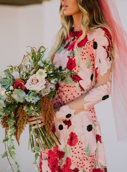 Rustic Joshua Tree wedding with a pink floral dress