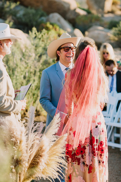 Rustic Joshua Tree wedding with a pink floral dress