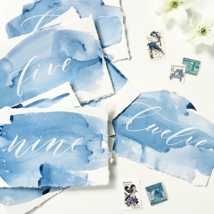 Calligraphy and watercolor escort cards