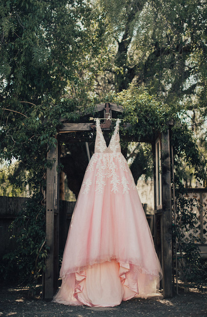 Rustic California wedding with a pink dress