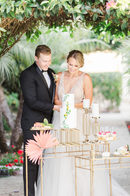 Colorful modern wedding with a killer tropical floral installation