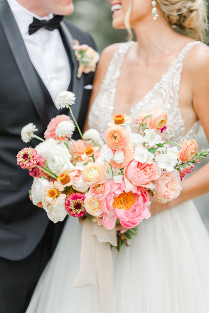 Colorful modern wedding with a killer tropical floral installation